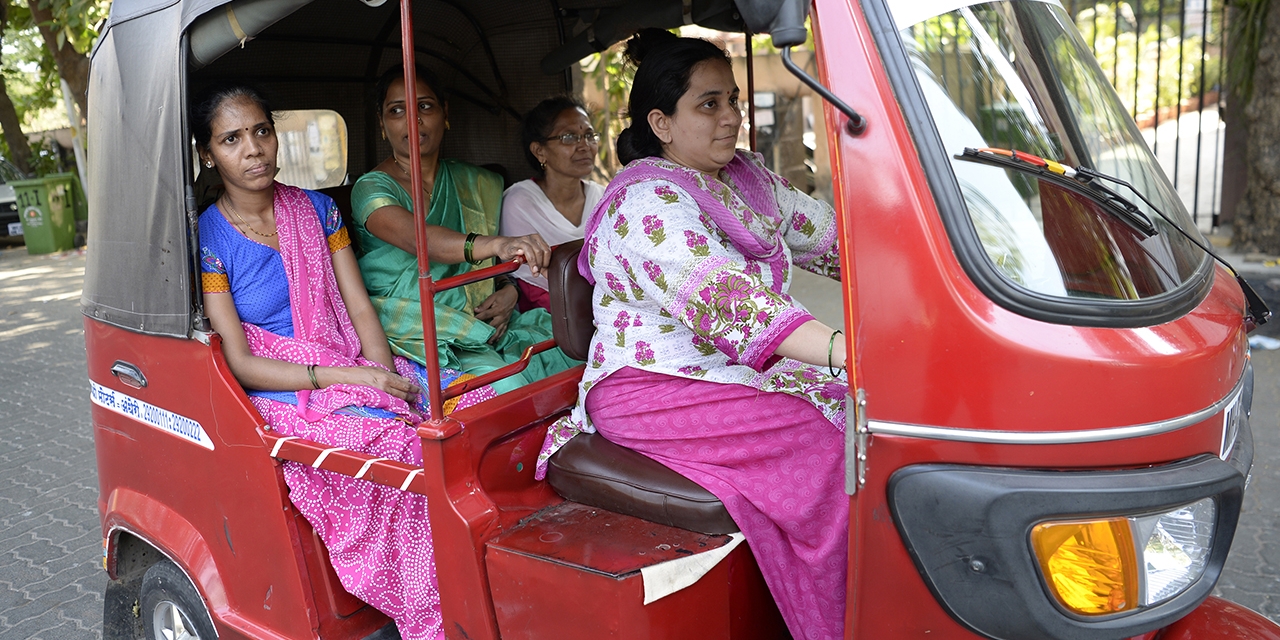 Indian woman rickshaw driver