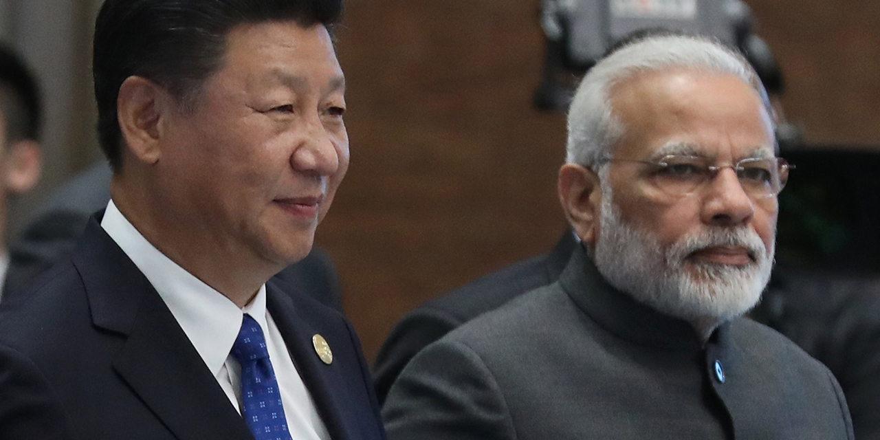 Chinese President Xi Jinping and Indian Prime Minister Narendra Modi attend the Dialogue of Emerging Market and Developing Countries on the sidelines of the 2017 BRICS Summit in Xiamen