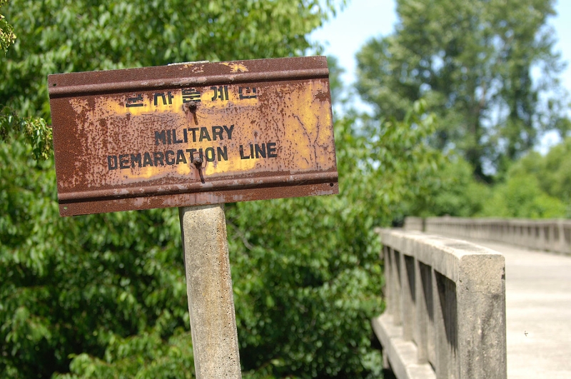 Inside the Korean Demilitarized Zone. Military Demarcation Line sign on the south side of the Bridge of No Return
