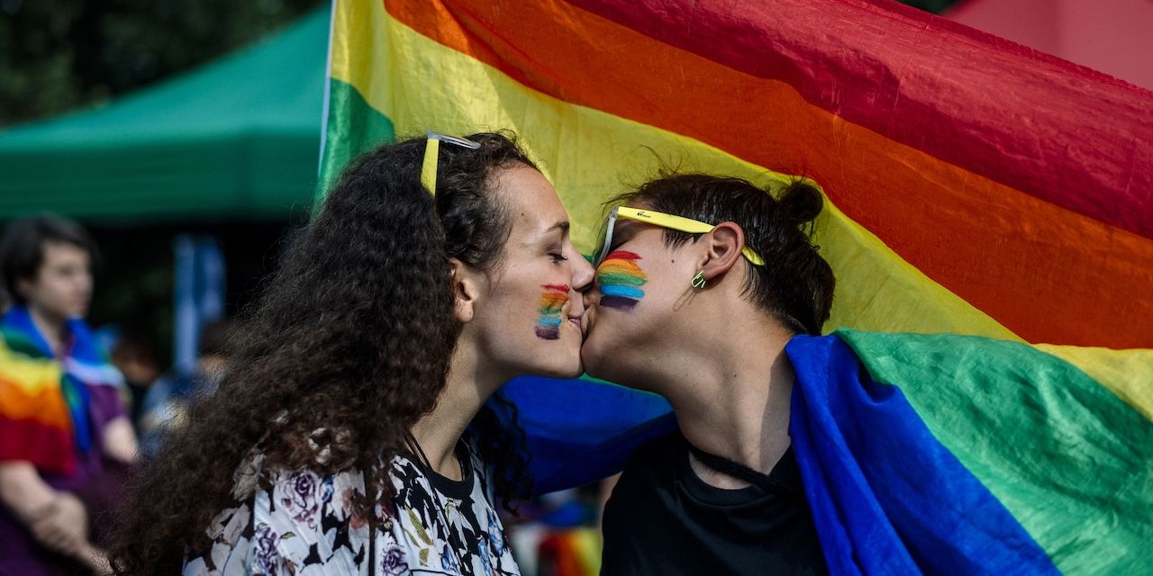 A couple kisses during the 11th Gay Pride Parade in downtown Sofia on June 9, 2018