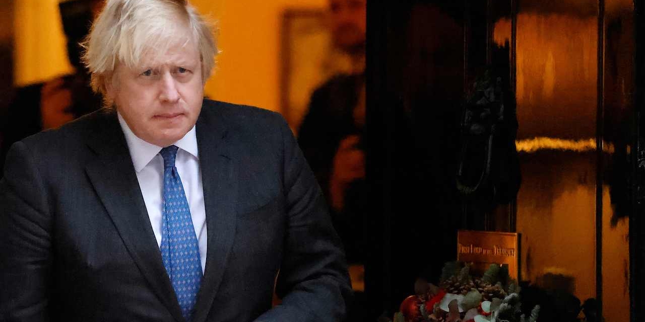Britain's Prime Minister Boris Johnson walks out to meet Oman's Sultan in Downing Street in London on December 16, 2021