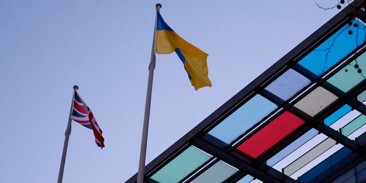 A Ukrainian flag flies beside a Union flag above the Home Office building in central London on February 26, 2022, in reaction to Russia's invasion of Ukraine