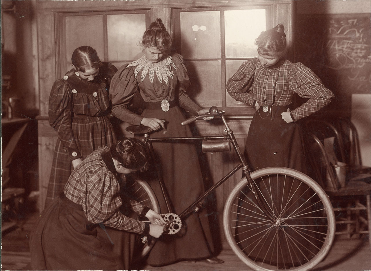 Women Repairing Bicycle, c. 1895, https://arc.lib.montana.edu/msu-photos/item/135, MSU Historical Photos Collection, Montana State University (MSU) Library, Bozeman, MT