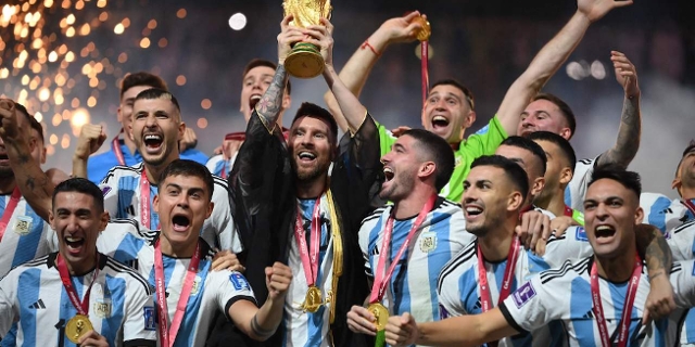 Argentina's forward #10 Lionel Messi lifts the World Cup trophy during the Qatar 2022 World Cup trophy ceremony after the football final match between Argentina and France