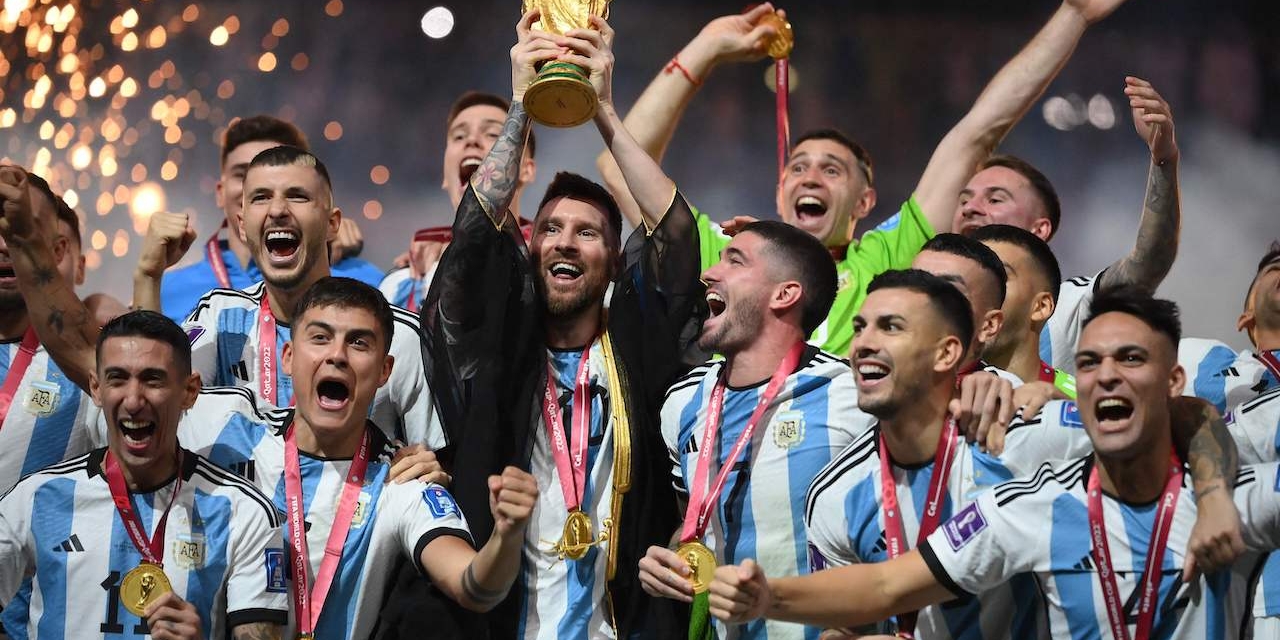 Argentina's forward #10 Lionel Messi lifts the World Cup trophy during the Qatar 2022 World Cup trophy ceremony after the football final match between Argentina and France
