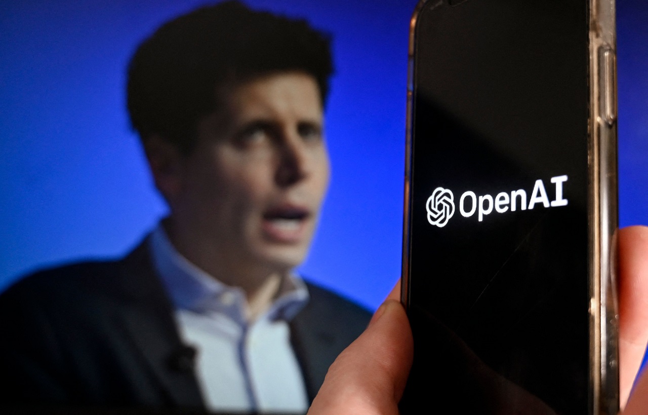 This illustration photo shows a smart phone screen displaying the logo of OpenAI juxtaposed with a screen showing a photo of former OpenAI CEO Sam Altman